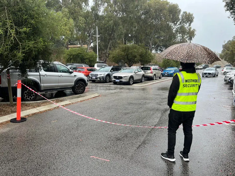 Westwide officer managing vehicle access in wet weather